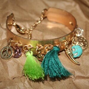 Golden bangle with charms